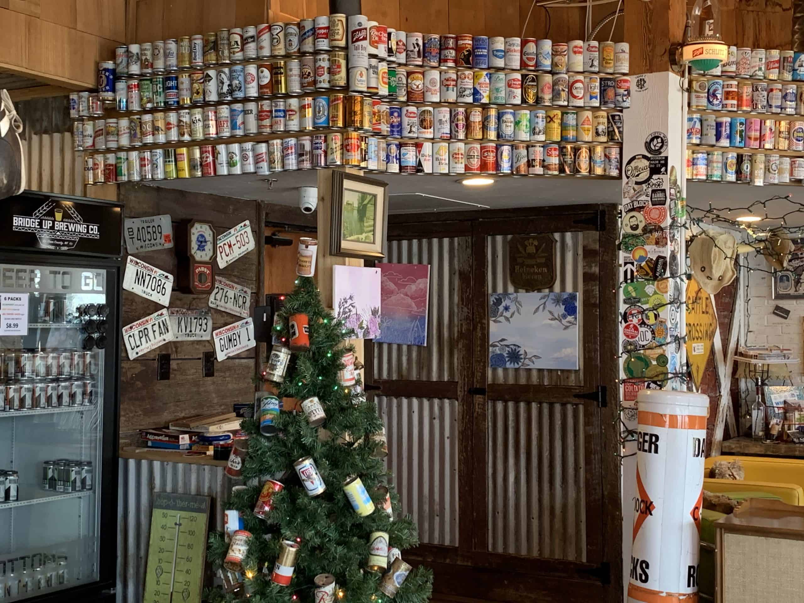 Vintage beer bottles and can collection at Bridge Up Brewing craft beer brewery and taprooms in Door County Wisconsin