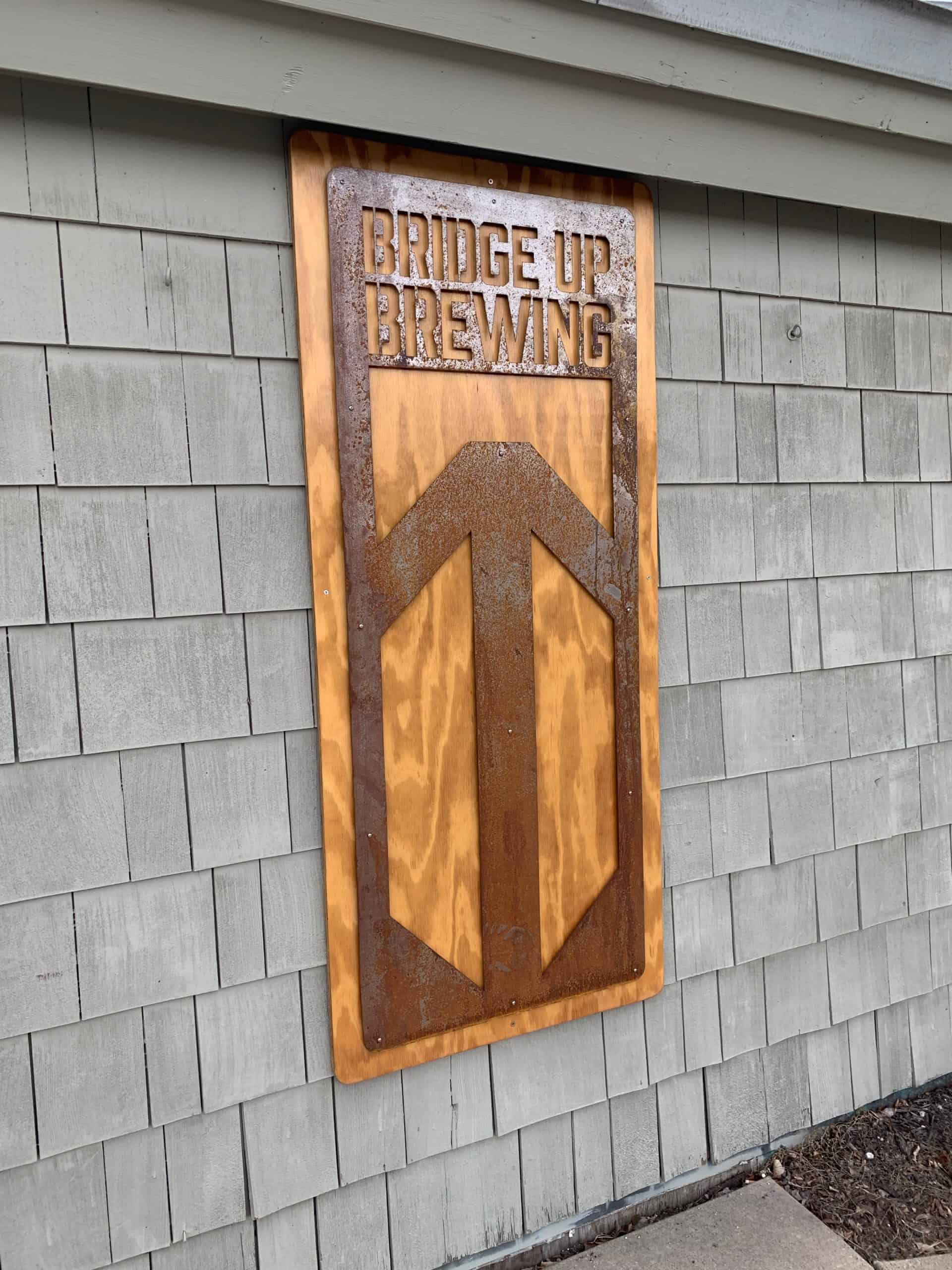 Bridge Up Brewing craft beer brewery and taprooms in Door County Wisconsin wooden sign