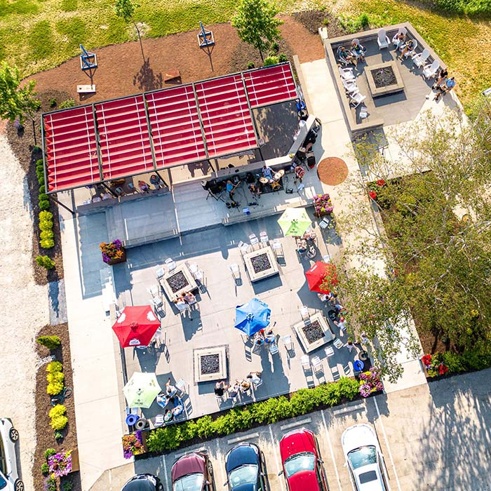 Aerial view of the outdoor beer garden patio at Bridge Up Brewing craft beer brewery and taprooms in Door County Fish Creek Wisconsin